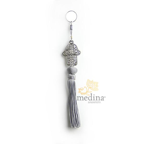Porte cles main de fatima en métal argenté et pompon en soie Gris