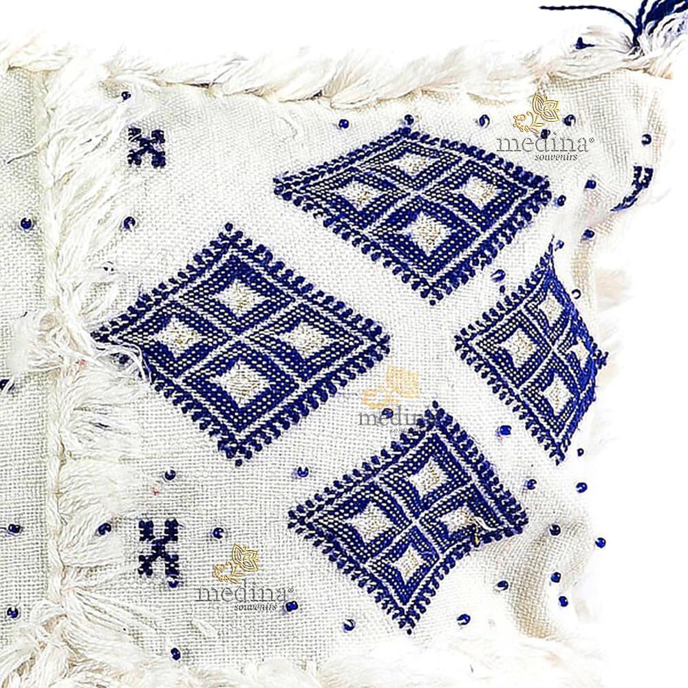 Coussin design berbere en laine vierge tissé main blanc et bleu